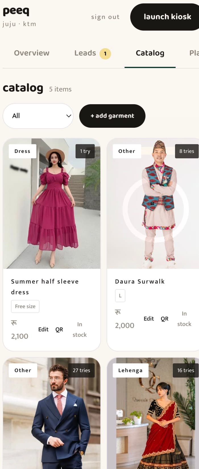 The peeq dashboard on a phone — catalog with try-on counts per garment